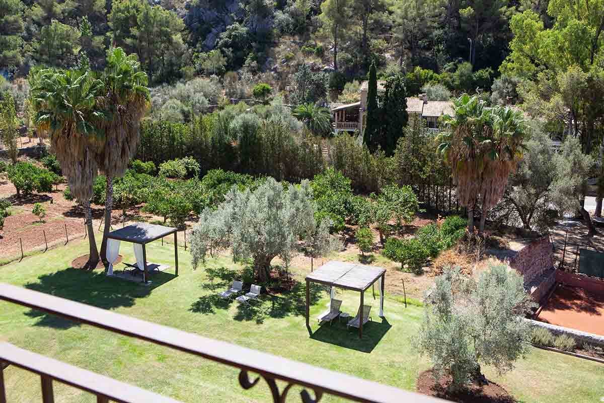 View of the gardens from guest bedroom terrace at Hotel Es Port in Spain.