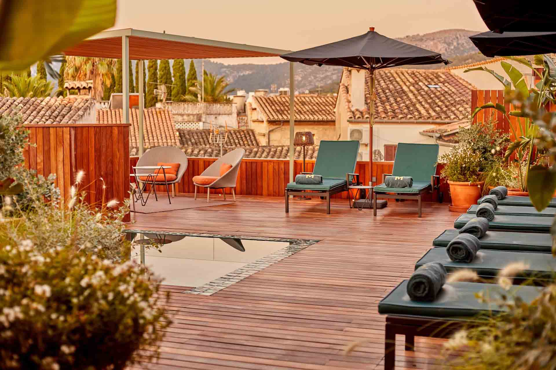 Pool and lounge chairs at Mon Boutique hotel in Spain.