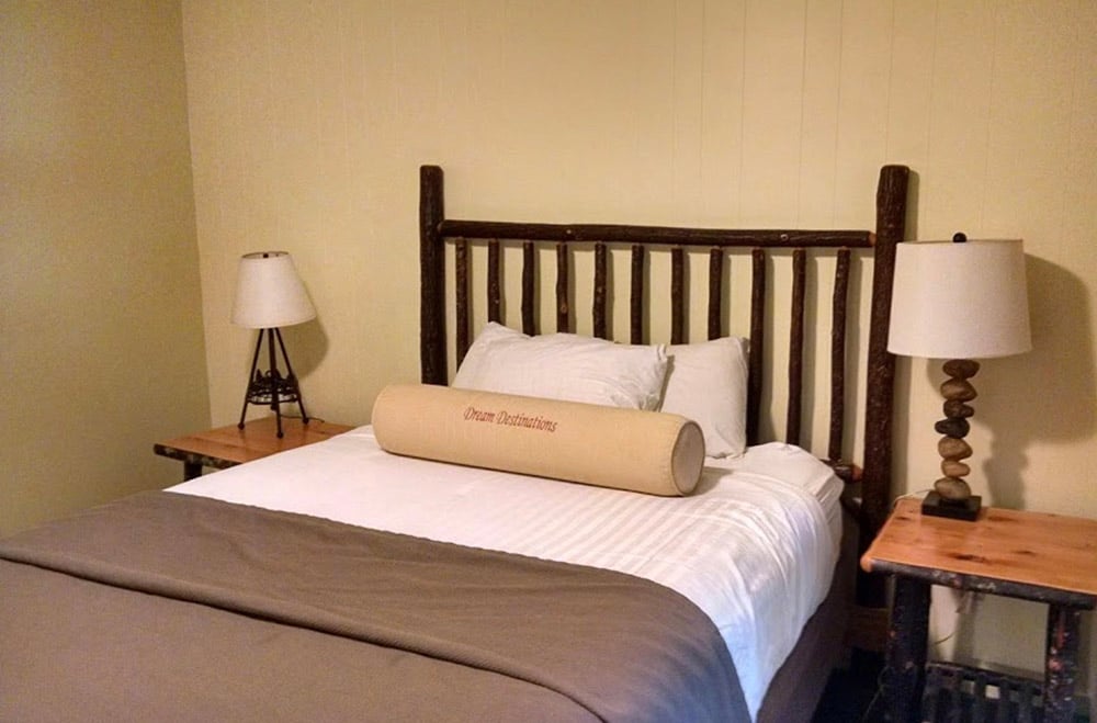 a single bed with two nightstands