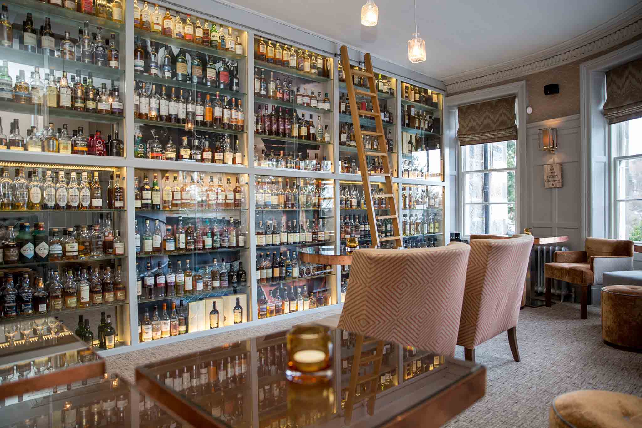 Large liquor cabinet in bar at The Dowans Hotel in Scotland