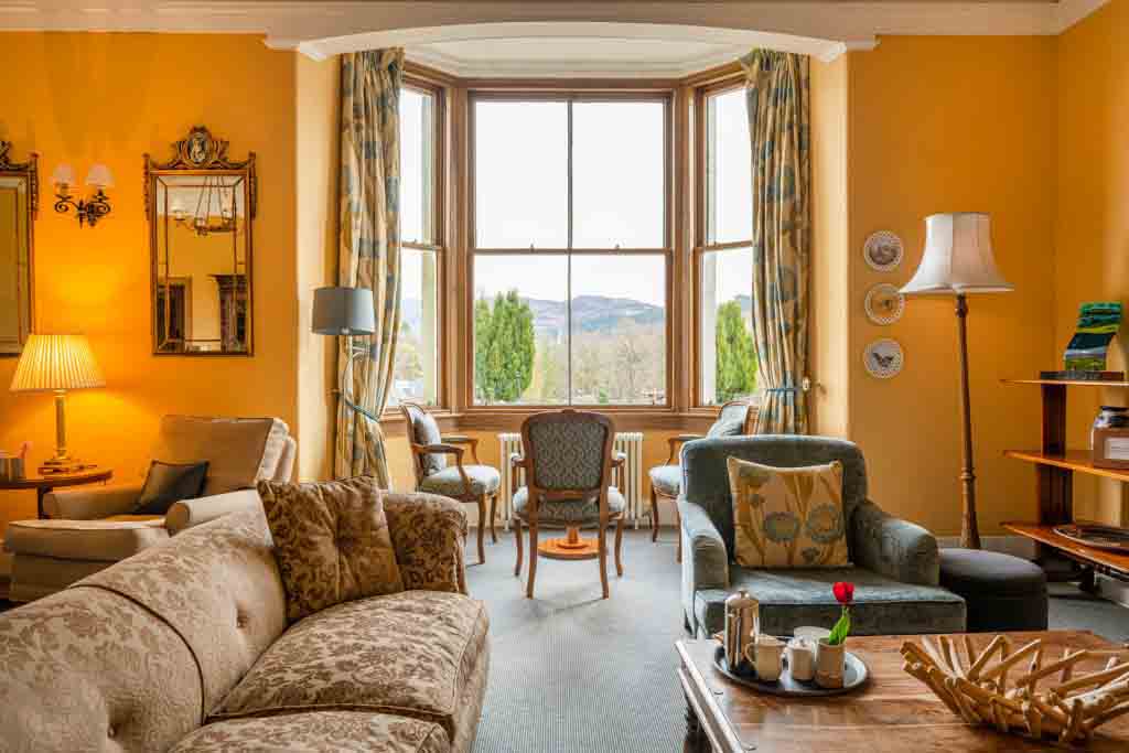 Sofa and armchairs in lounge at the Lovat Loch Ness hotel in Scotland