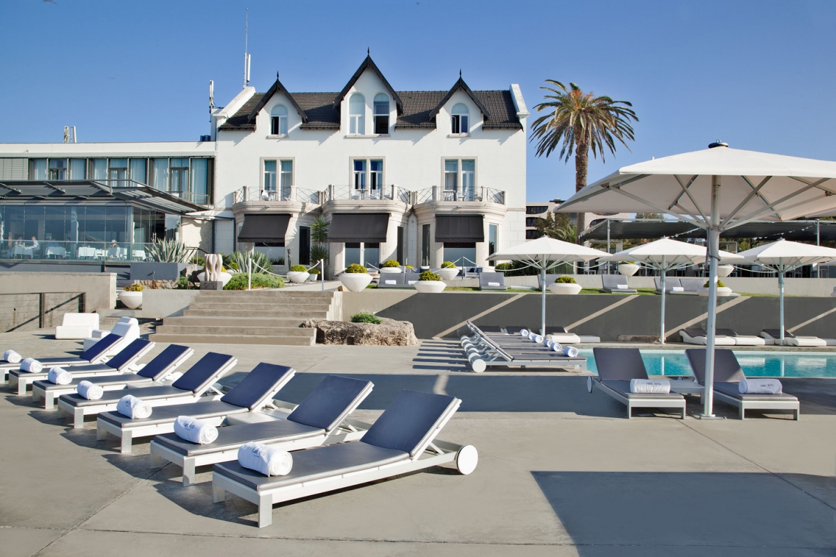 Sunchairs on pool deck at Farol Hotel