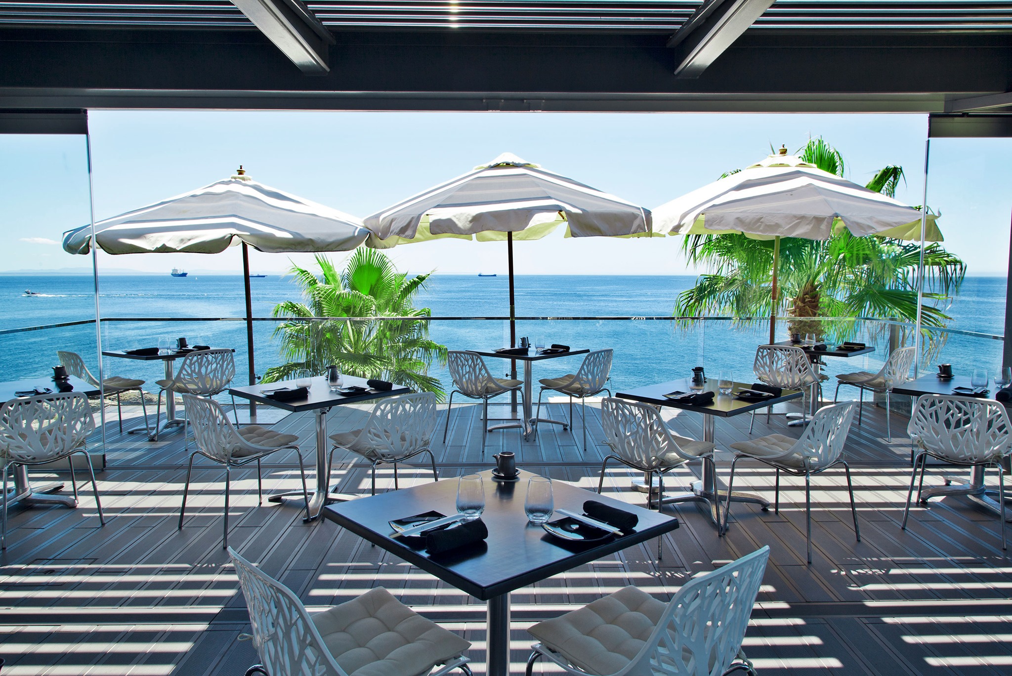 Table and chairs on terrace at Farol Hotel