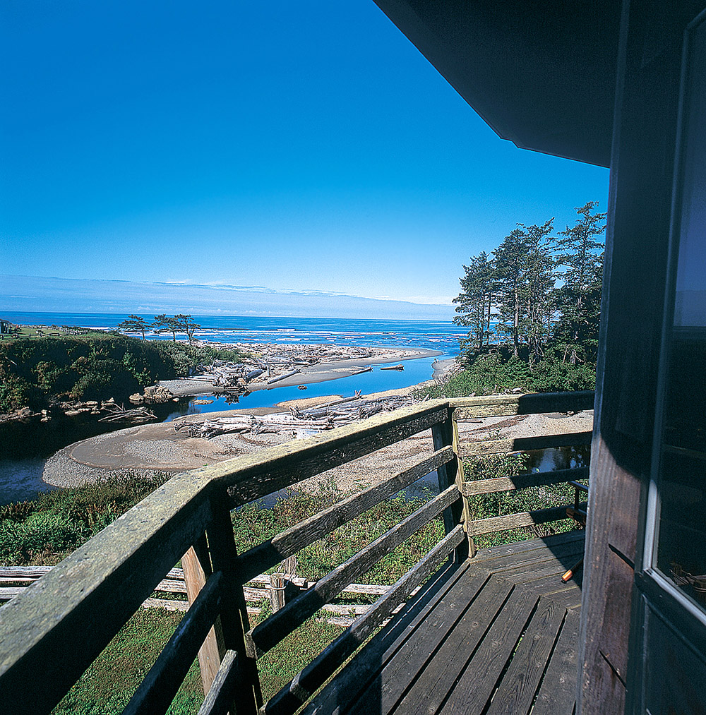 view overlooking trees and beaches to the ocean from a high vantage point