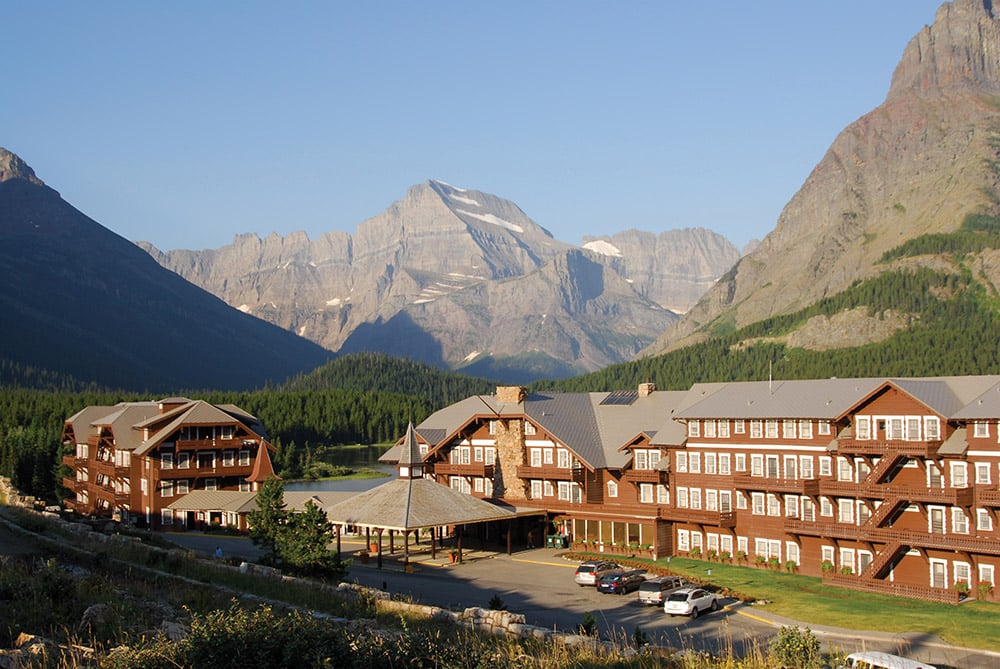 Glacier Hotel lodge exterior with mountains surrounding it